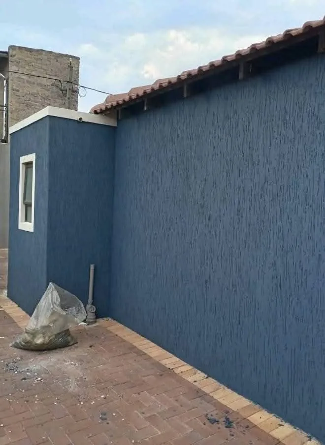 Exterior painting project on a boundary wall