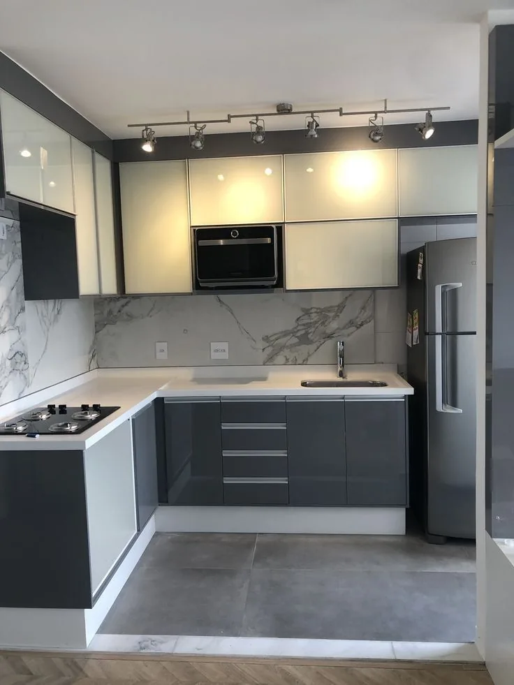 Kitchen renovation featuring dark cabinetry and new finishes